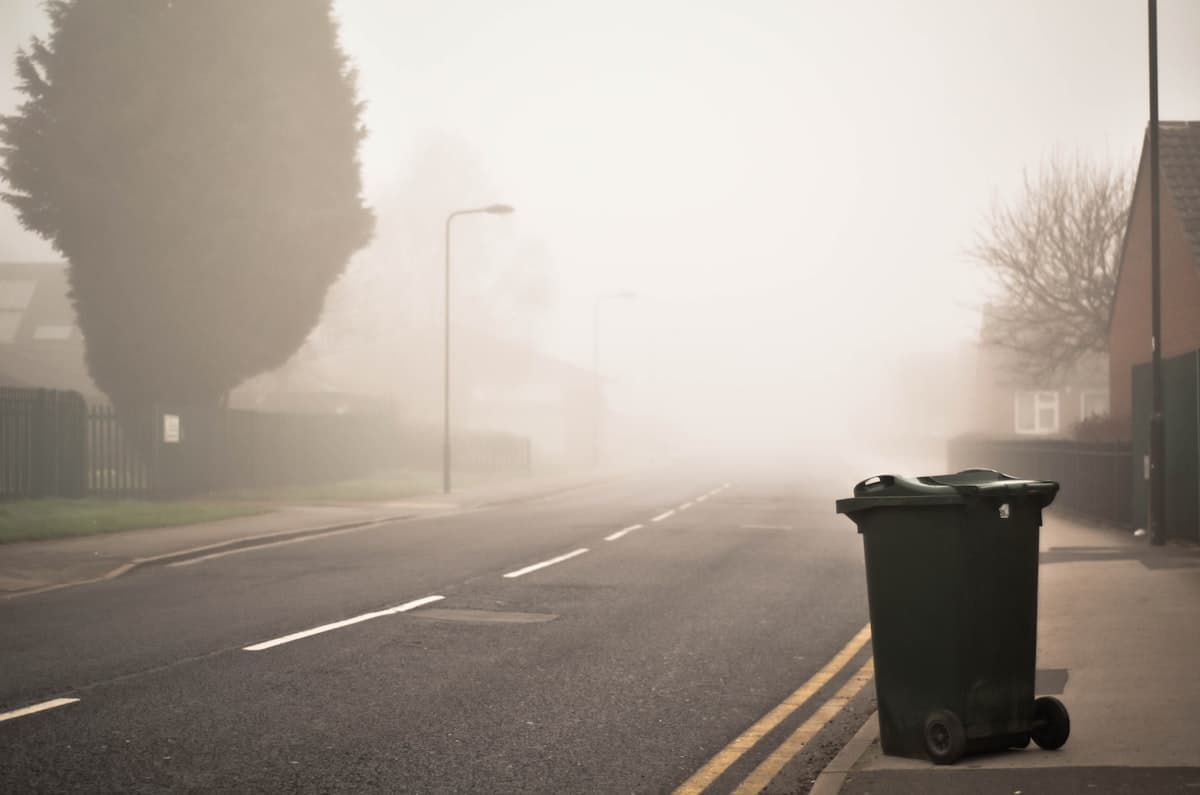 A single wheelie bin on a quiet street